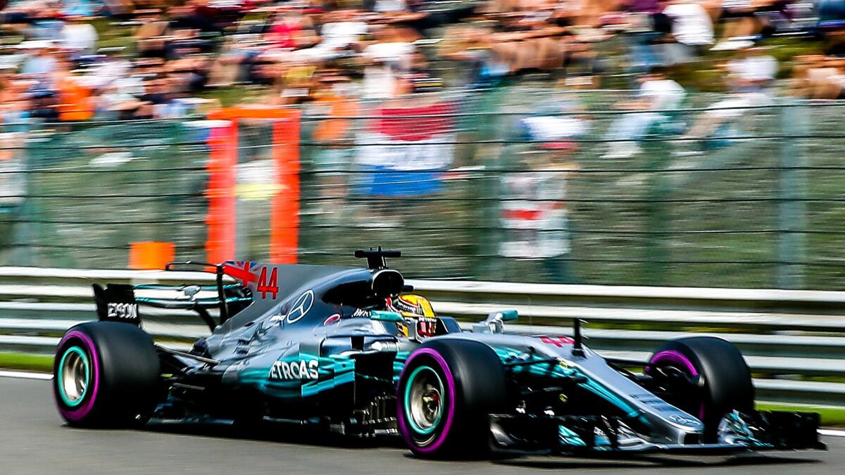 Formula One driver Lewis Hamilton guides his Mercedes through the course at the Spa-Francorchamps race track Saturday.