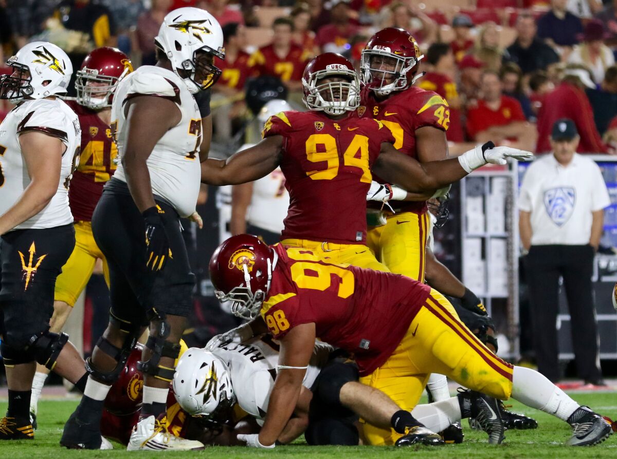 USC defensive lineman Rasheem Green (94) celebrates after the Trojans make a stop in the backfield against Arizona State.