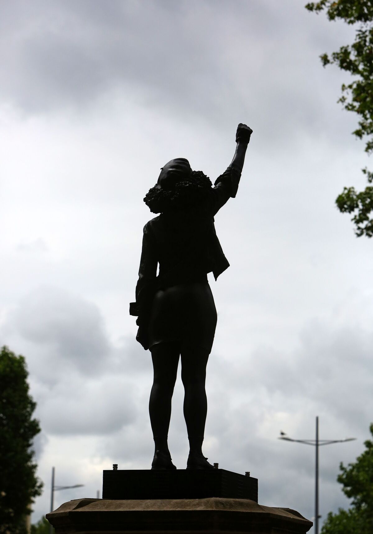  A statue of Jen Reid with an arm raised in a Black Power salute