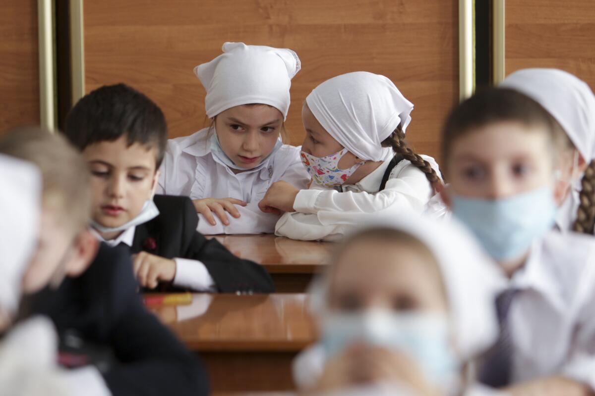 Pupils wear face masks in Grozny, Russia