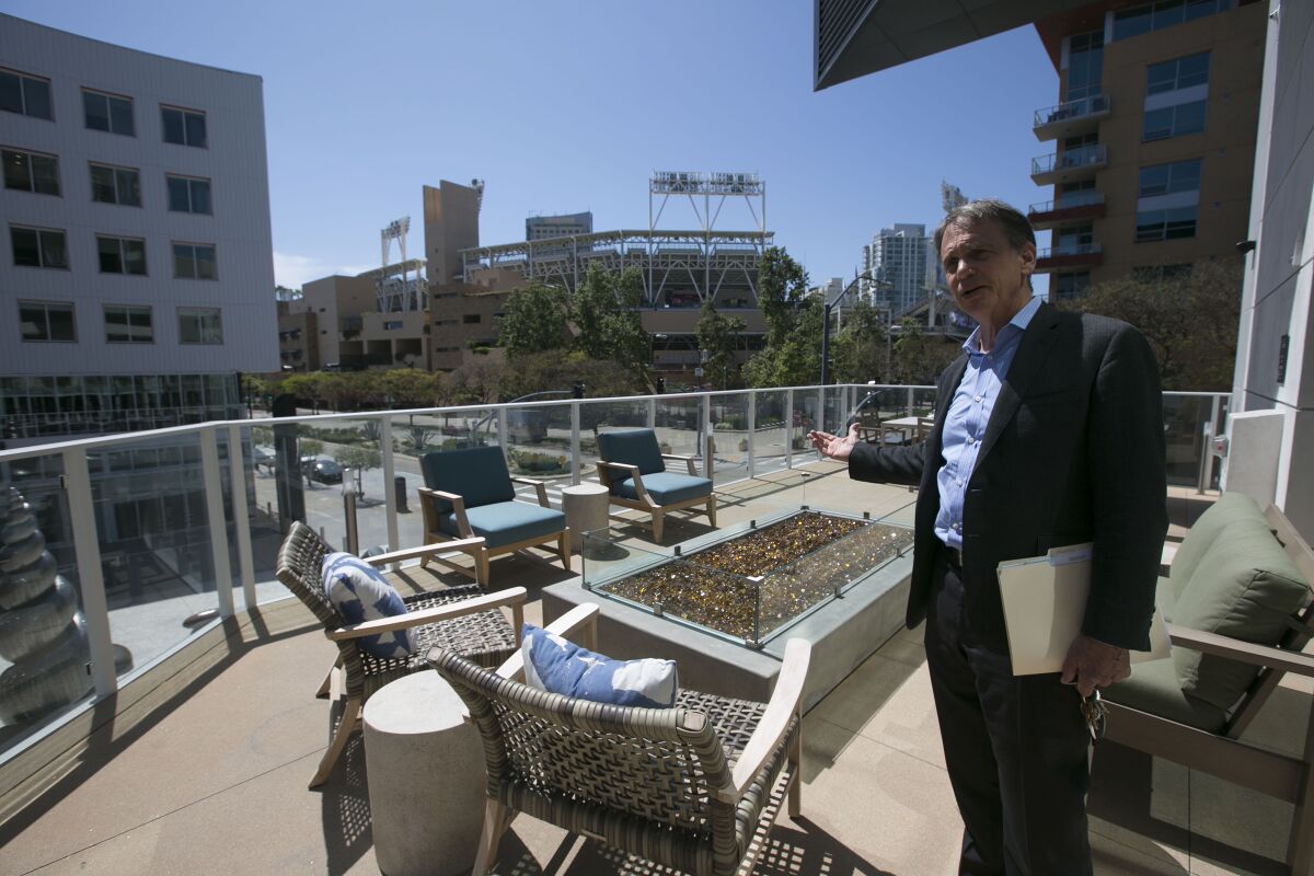 The amount of money that San Diegans spent on rent has increased greatly over 10 years. Pictured is Greystar senior managing director Jerry Brand at one of the common areas at the Park 12 apartment complex across the street from the entrance to Petco Park.