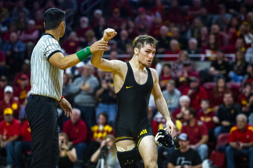 FILE - In this Nov. 24, 2019, file photo, Iowa's Spencer Lee wins by technical fall against Iowa State's Alex Mackall at 125 pounds during the Cy-Hawk dual wrestling match at Hilton Coliseum, in Ames, Iowa. Lee and Oregon women’s basketball star Sabrina Ionescu shared the Sullivan Award on Wednesday night, April 29, 2020, as the country’s top amateur athlete. (Kelsey Kremer/The Des Moines Register via AP, File)
