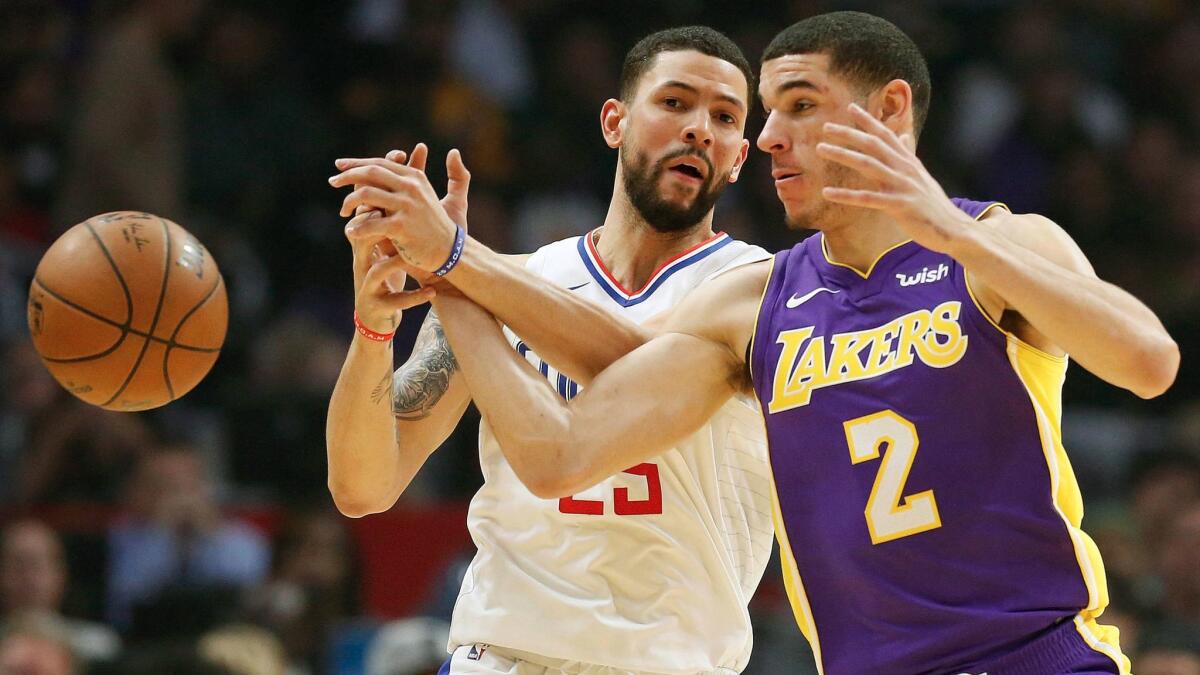 Lakers' Lonzo Ball goes for the steal against Clippers' Austin Rivers Nov. 27 at Staples Center.