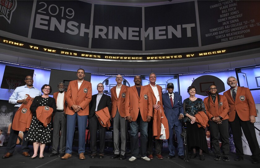 The class of 2019 inductees into the Basketball Hall of Fame, from left to right, Chuck Cooper III, accepting on behalf of his late father Chuck Cooper, Susan Braun, accepting on behalf of her later father Carl Braun, Al Attles,Vlade Divac, Ron Coville accepting on behalf of his father-in-law, Bill Fitch, Bobby Jones, Sidney Moncrief, Jack Sikma, Dick Barnett for Tennessee A&I, Linda Price for Wayland Baptist, Teresa Weatherspoon, and Paul Westphal.