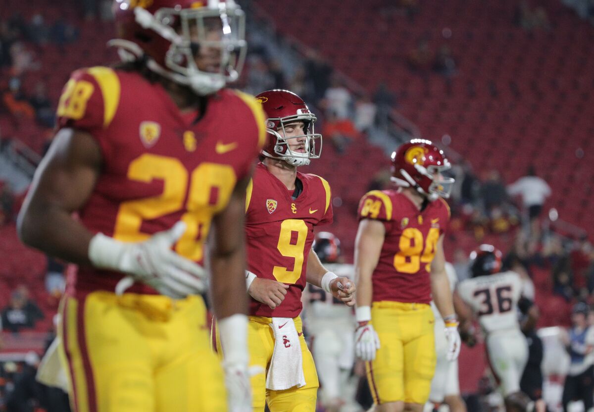 Kedon Slovis (9) walks off the field after throwing an interception late in the Trojans 45-27 loss to Oregon State