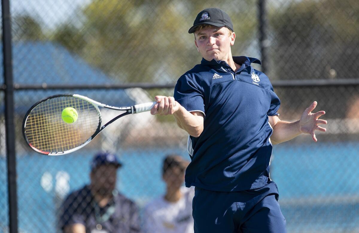 Newport Harbor High's Josh Watkins returns a shot against Edison's Jason You during a Wave League match on Thursday.