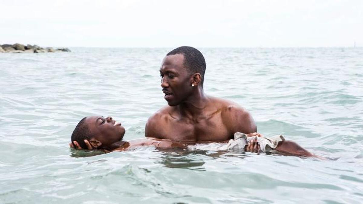 Alex Hibbert and Mahershala Ali in the movie "Moonlight."