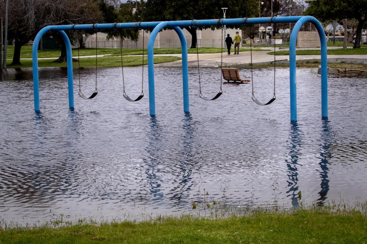 Rain flooded a playground at Edison Community Park Monday, and is expected to intensify this week.