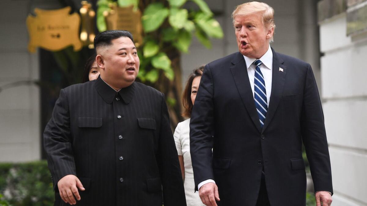 President Trump talks with North Korean leader Kim Jong Un on Feb 28 in Hanoi.