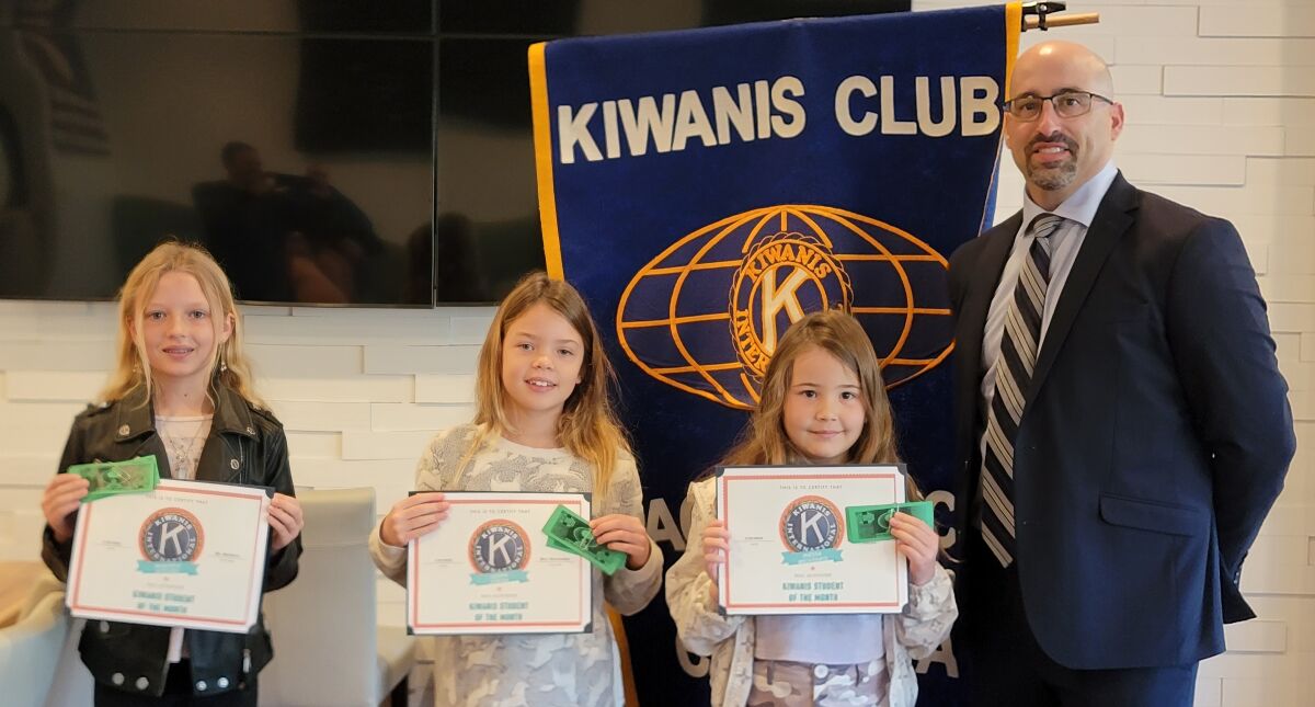 January honorees Makayla Kitchen, Leona Casillan-Strom and Inessa Brovenko with Pacific Beach Kiwanis President Tony Bayona.