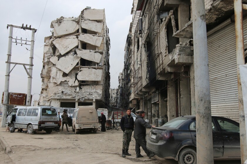 Evidence of years of civil war can be seen in a heavily damaged building in Aleppo, Syria, on Feb. 11.