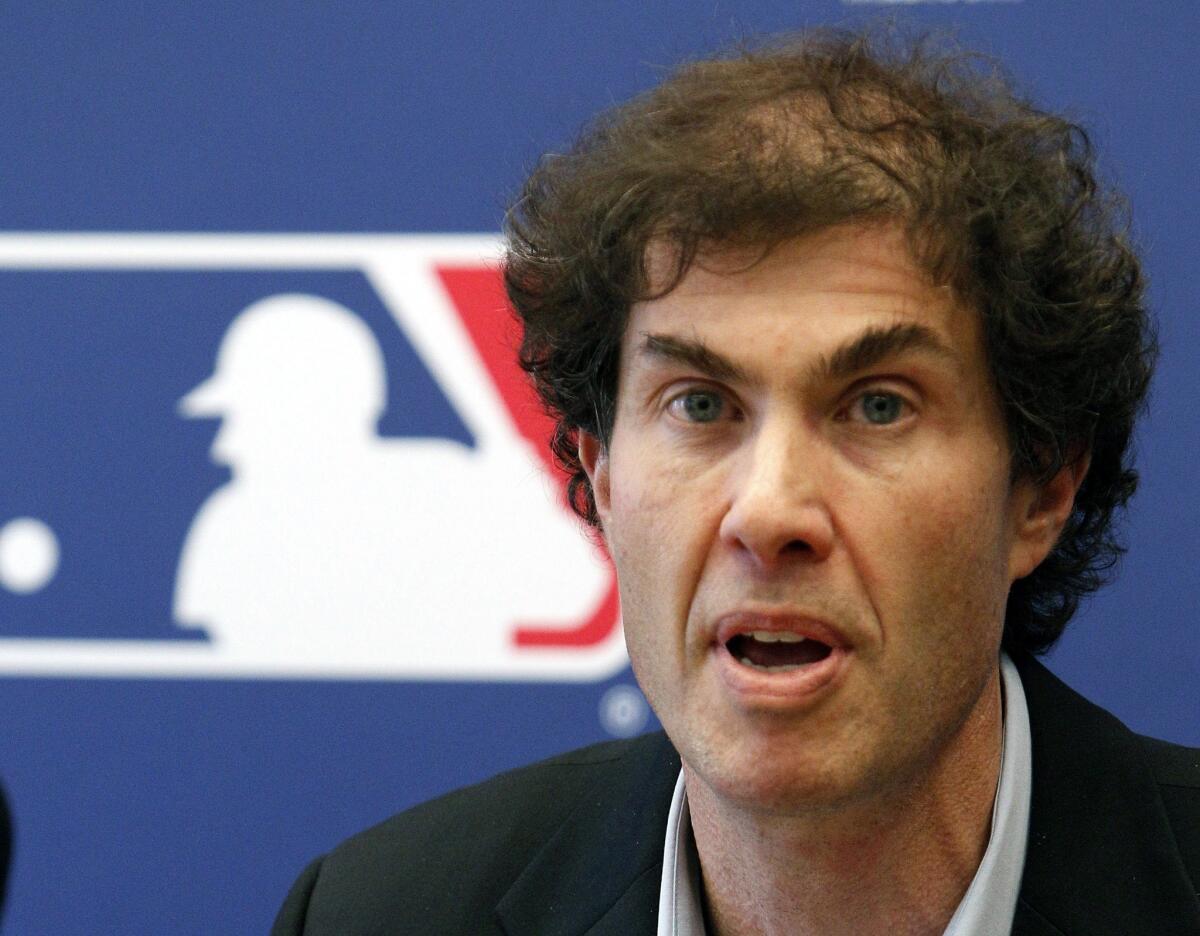 Michael Weiner, executive director of the Major League Baseball Players Assn., shown in 2011, continues to work despite being diagnosed with brain cancer last year.