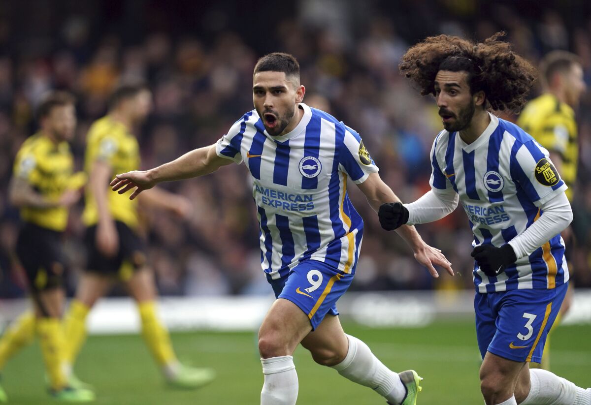 Brighton and Hove Albion's Neal Maupay celebrates scoring during the English Premier League soccer match between Watford and Brighton and Hove Albion at Vicarage Road, Watford, Saturday Feb. 12, 2022. (Nick Potts/PA via AP)