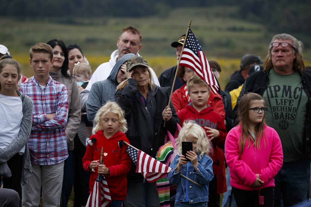 People look on during the September 11th Flight 93 Memorial Service, Tuesday, Sept. 11, 2018, in Shanksville, Pa. (AP Photo/Evan Vucci)