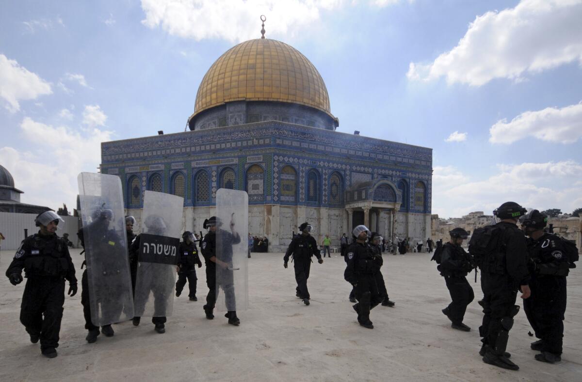 In this Oct. 5, 2012, file photo, Israeli forces take position during clashes with Palestinian worshippers at the Al Aqsa Mosque compound in Jerusalem's Old City.