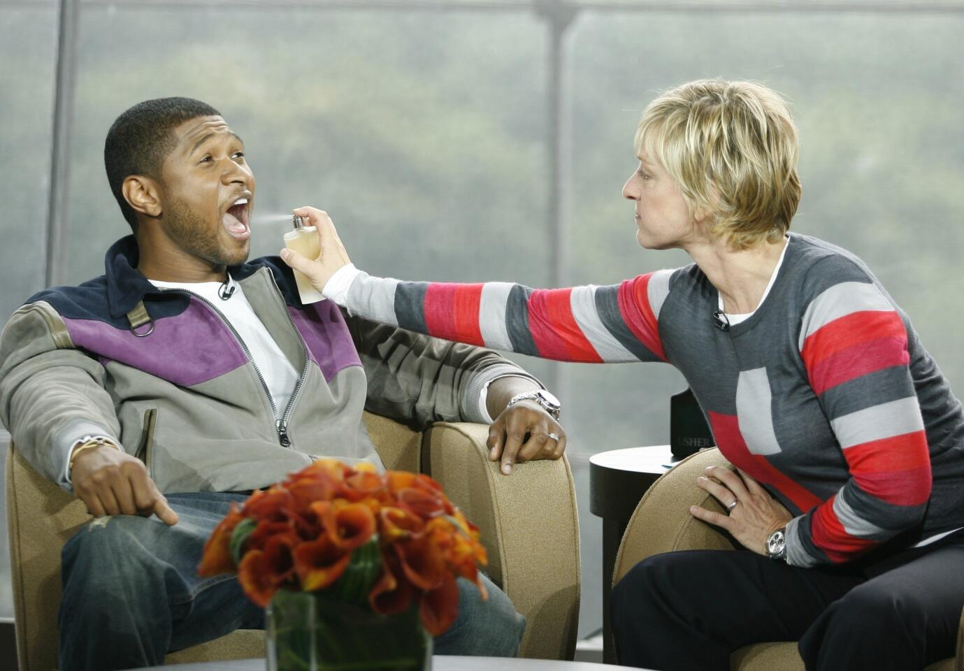 Ellen DeGeneres gives Usher a sample of his newest scent, "Usher She," in the Allen Room, Frederick P. Rose Hall, at Lincoln Center, on Aug. 31, 2007.