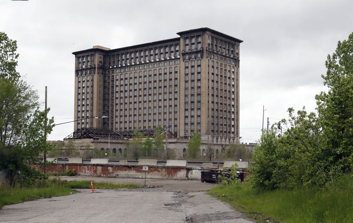 File — Exterior view of the Michigan Central train depot, shown May 23, 2019, in Detroit. Ford Motor Co. announced Friday, Feb. 4, 2022, that Google is joining the automaker's effort to transform a once-dilapidated Detroit train station into a research hub focused on electric and self-driving vehicles. (AP Photo/Carlos Osorio, file)