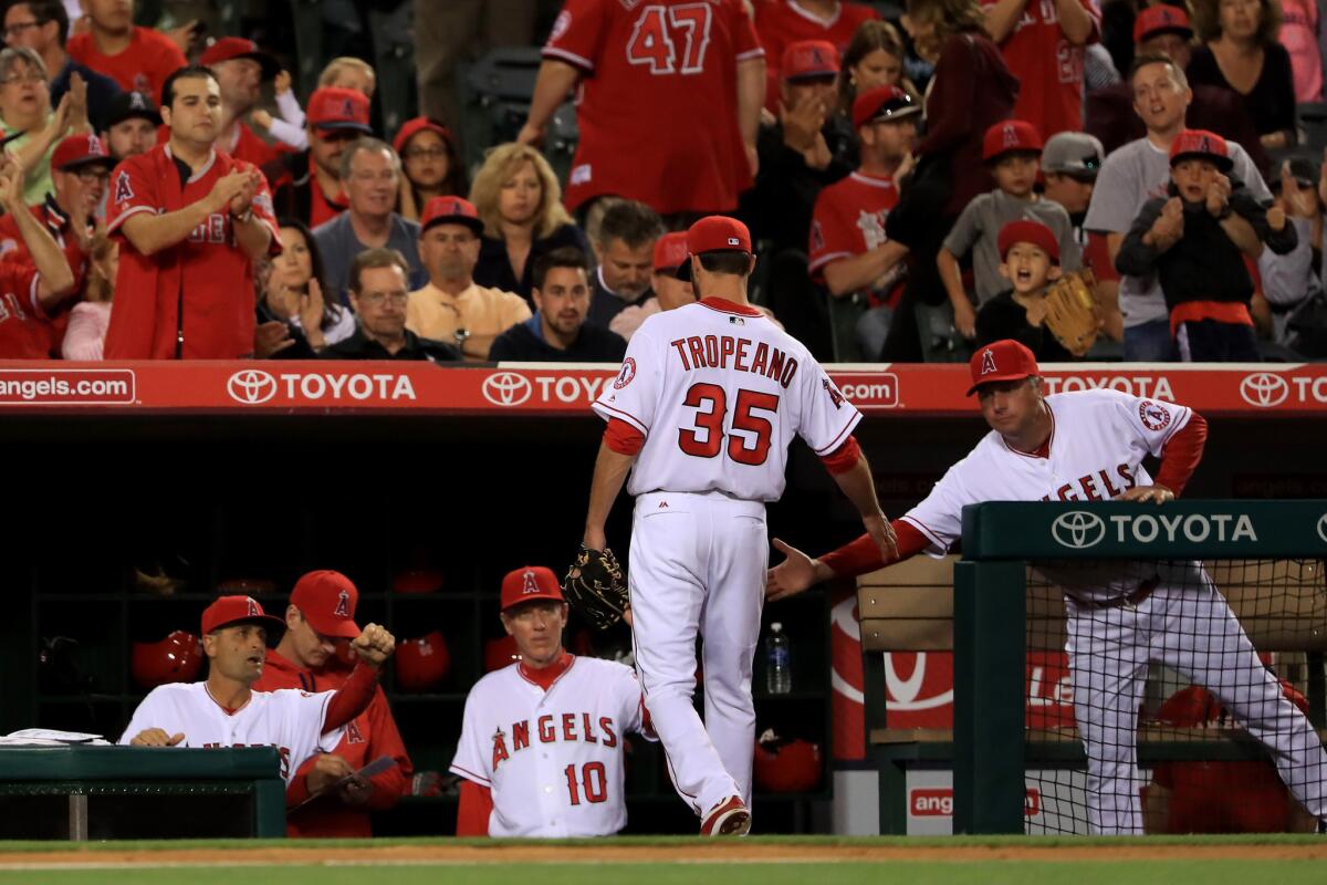 Nick Tropeano heads to the dugout after getting pulled in the sixth inning of the Angels' 5-2 loss to the Mariners at Angel Stadium on April 22.