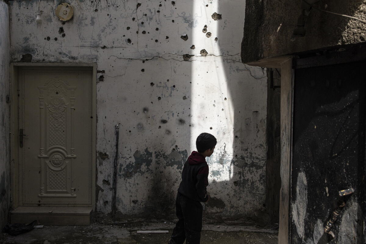 Ullet Riddled Wall Symbolic West Bank refugee camp lies in ruins after Israeli campaign ...