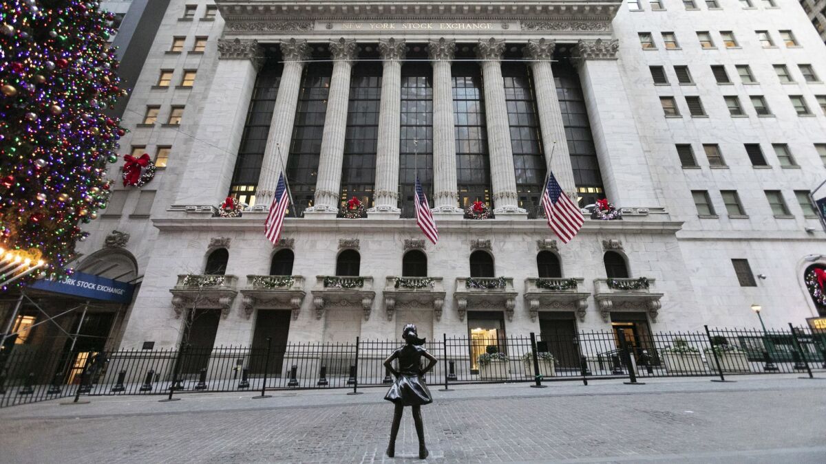 The Fearless Girl statue stands at its new location in front of the New York Stock Exchange.