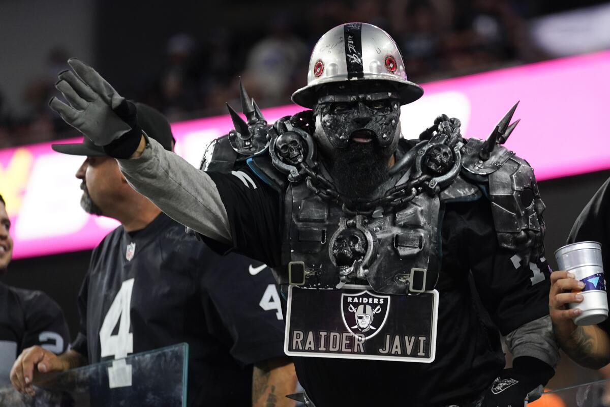 A Las Vegas Raiders fan shows off his game face before Monday's game at SoFi Stadium.