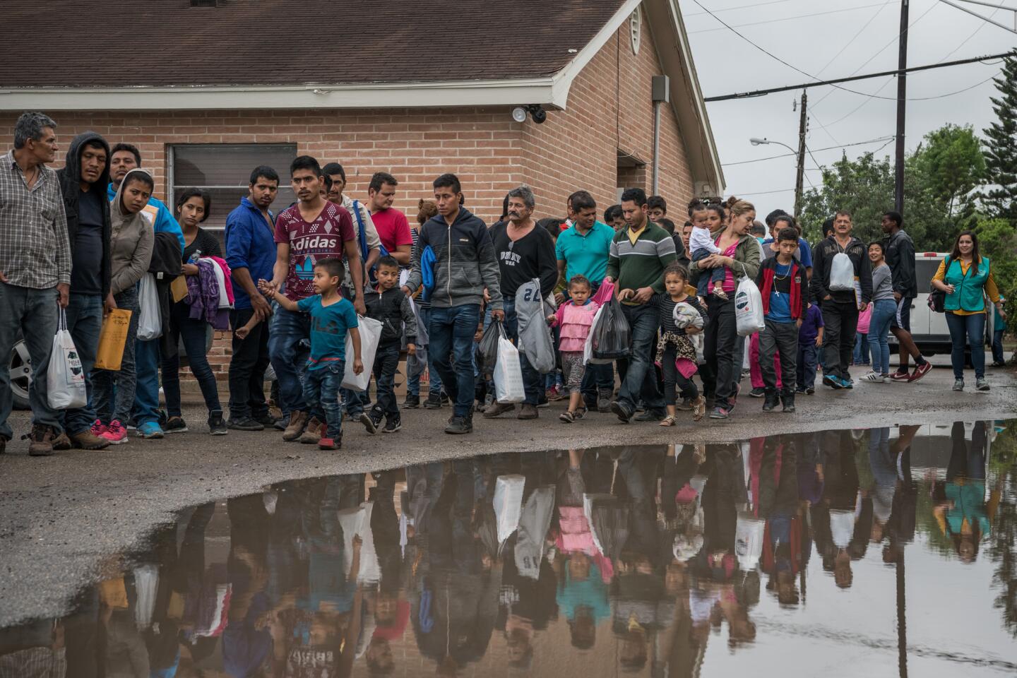 Central American migrants arrive at a Catholic Charities respite center on Wednesday, March 20, 2019 in McAllen, Texas. The migrant families passing through the respite center continue on to various parts of the country, where they await future court dates to determine whether they'll be permitted to stay in the U.S.