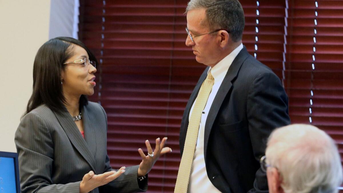 Orlando-area State Atty. Aramis Ayala, left, with colleague Brad King.