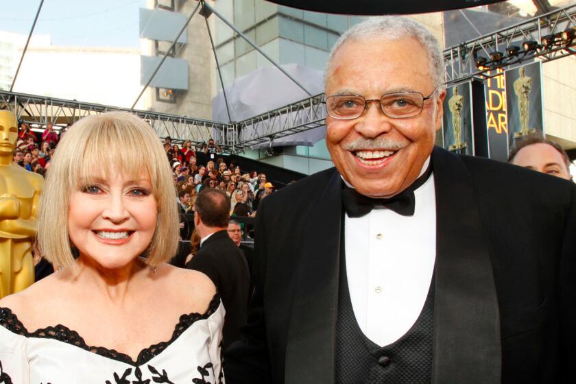 Cecilia Hart with her husband, James Earl Jones, at the Oscars in 2012.