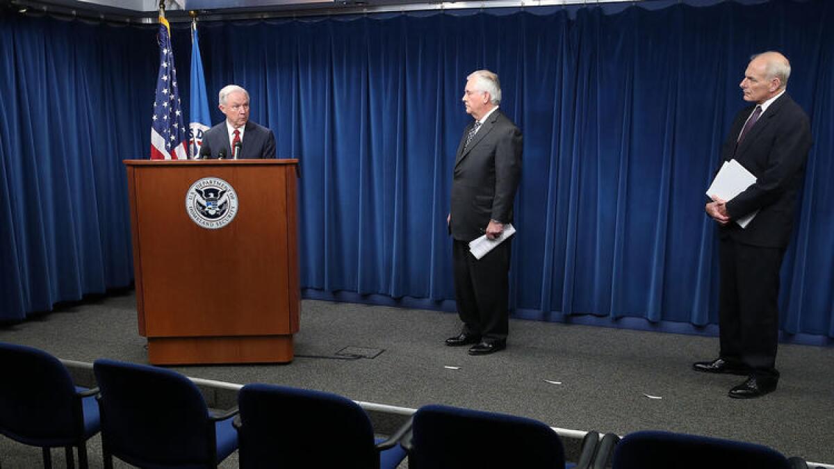 Atty. Gen. Jeff Sessions, left, Secretary of State Rex Tillerson, center, and Homeland Security Secretary John F. Kelly.
