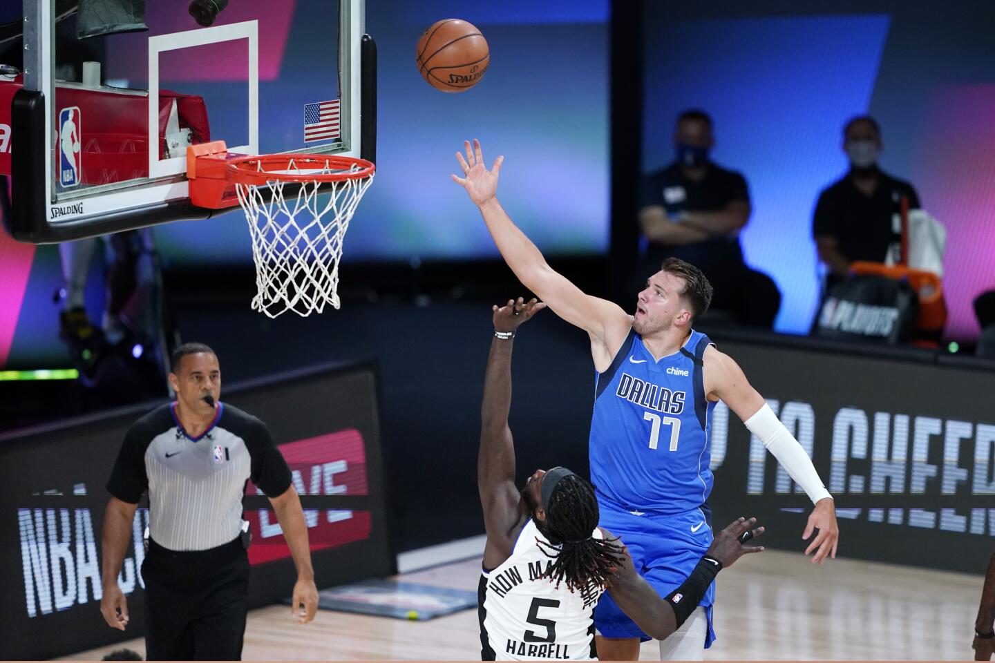 Dallas Mavericks guard Luka Doncic shoots over Clippers forward Montrezl Harrell during Game 3.