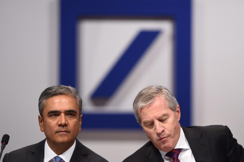 Anshu Jain, left, and Juergen Fitschen have agreed to step down as co-CEOs of Deutsche Bank.