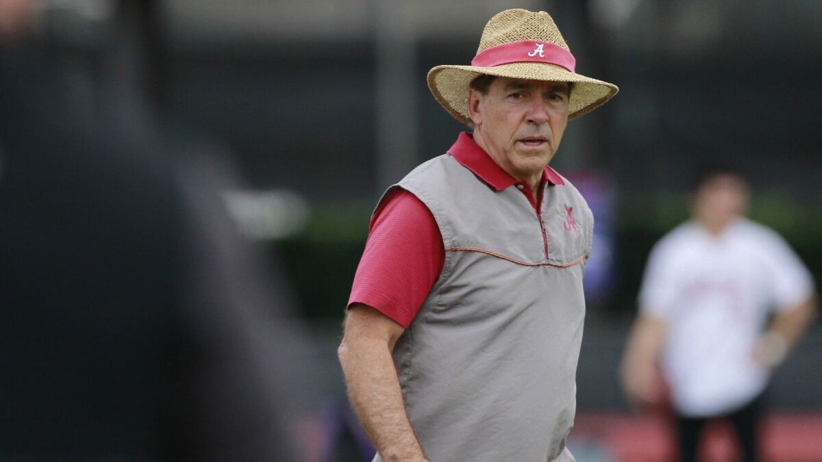Alabama head coach Nick Saban walks the field at practice in Miami Shores, Fla., for the Orange Bowl against Oklahoma on Saturday.