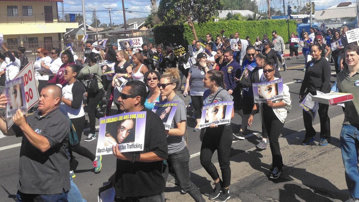 A Los Angeles march against sex trafficking drew hundreds of people carrying signs and chanting "Our children are not for sale."