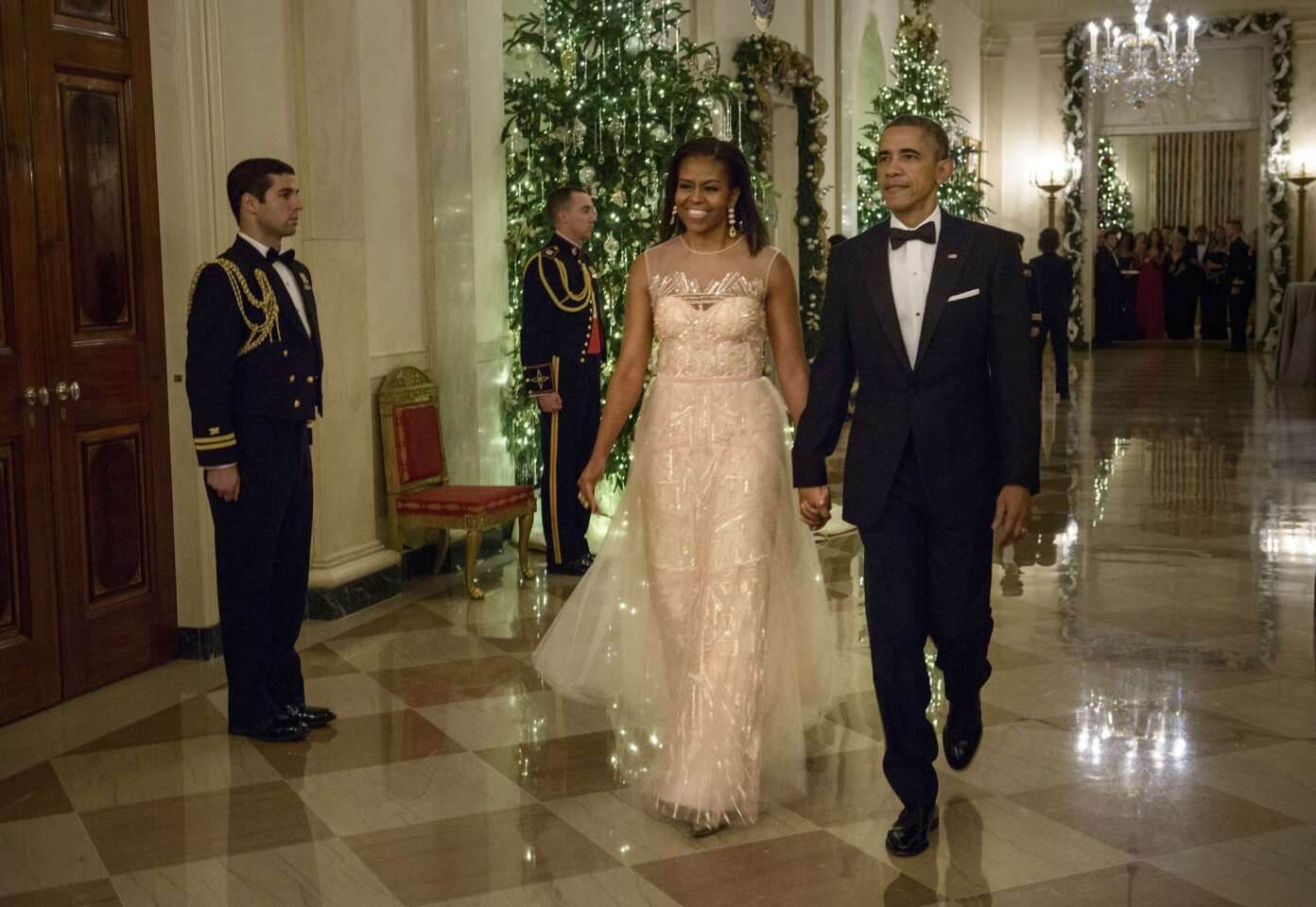 First Lady Michelle Obama and President Obama arrive for the 37th Kennedy Center Honors in the East Room of the White House in Washington, DC.
