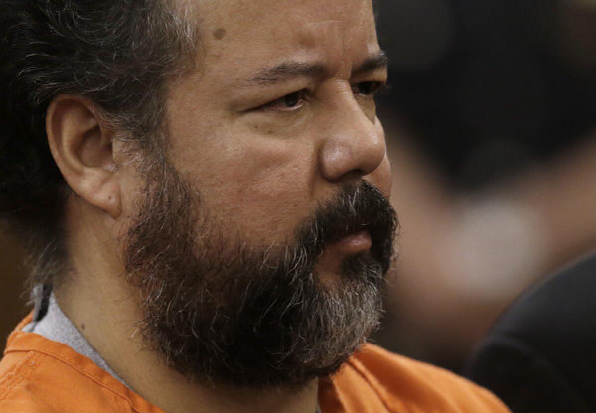 Ariel Castro stands before a judge during his arraignment on an expanded 977-count indictment in Cleveland. Castro is charged with kidnapping and raping three women over a decade in his home.