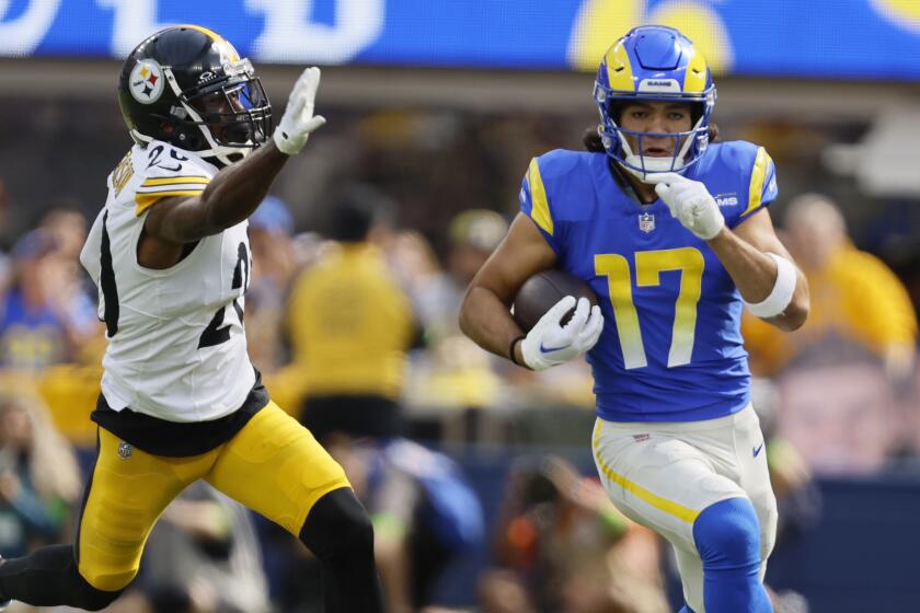 Rams receiver Puka Nacua runs in open field past the Steelers' Patrick Peterson.