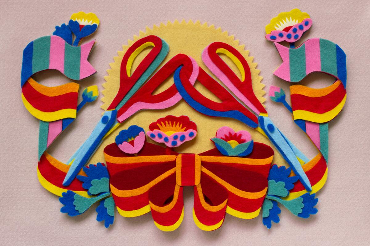 A felt design of interlocked scissors cutting a ribbon adorned with flowers.