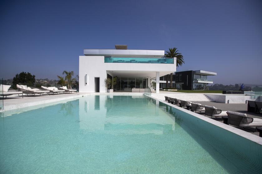 Beverly Hills, CA - September 08: A view of a pool with 4,000-square bedroom above with private pool at the "The One Bel Air", a 105,000-square-foot mansion by Nile Niami of Skyline Development and designed by Paul McClean (McClean Design). The One is shown by court-appointed receiver Ted Lanes, who now controls the property and is in charge of finding a buyer and paying off the lenders and other creditors, gives a tour of The One, the 105,000 square foot house on sale in Bel Air. This is apparently the largest home for sale in the United States. The developer Nial Niami "listed" it for $500 million but got into financial trouble and was foreclosed upon by Don Hankey. Photo taken in Bel Air on Wednesday, Sept. 8, 2021 in Beverly Hills, CA. (Allen J. Schaben / Los Angeles Times)