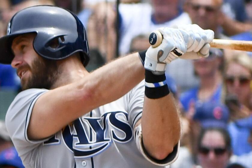 Tampa Bay Rays Evan Longoria hits an RBI single during the first inning of a baseball game against the Chicago Cubs on Wednesday, July 5, 2017, in Chicago. (AP Photo/Matt Marton)