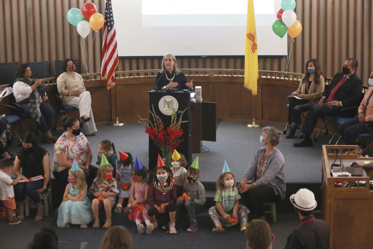 Gov. Michelle Lujan Grisham announces an increase in child care subsidies on Thursday, July 1, 2021, in Santa Fe, N.M. Subsidy eligibility expanded to families with income at 350% of the federal poverty line, the most generous in the nation. Lujan Grisham is calling for New Mexico to become the first U.S. state to offer universal child care. (AP Photo/Cedar Attanasio)