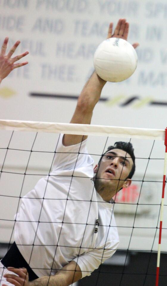 St. Francis' Markar Agakanian hits a kill against Chaminade in a boys volleyball match at St. Francs High School on Thursday, March 27, 2014. (Tim Berger/Staff Photographer)