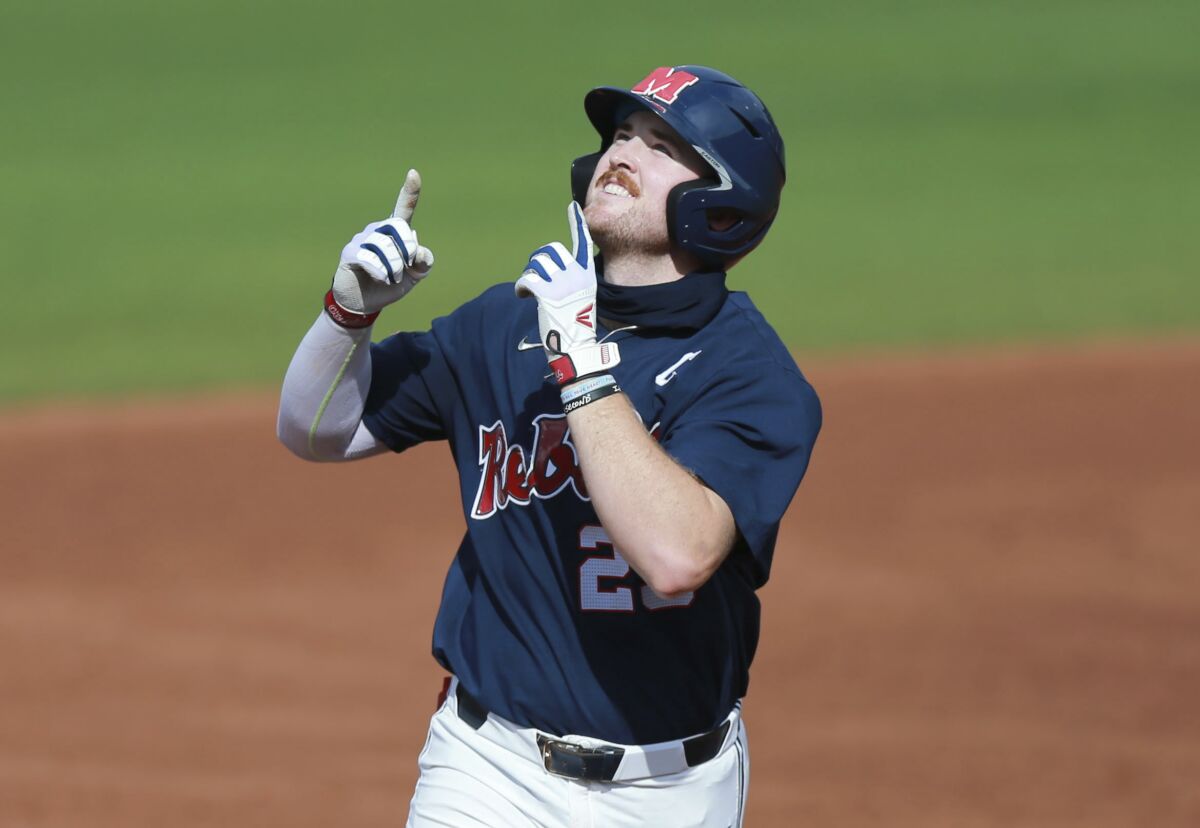 Mississippi's Tim Elko points skyward as he runs around the bases after hitting his second home run against Southern Mississippi during an NCAA college baseball tournament regional game Monday, June 7, 2021, in Oxford, Miss. (Thomas Wells/The Northeast Mississippi Daily Journal via AP)