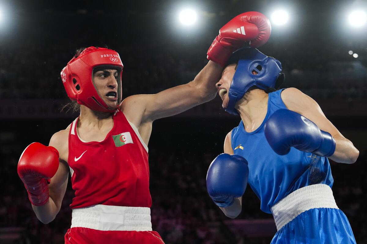 Algeria's Imane Khelif, left, fights China's Yang Liu in their wo 