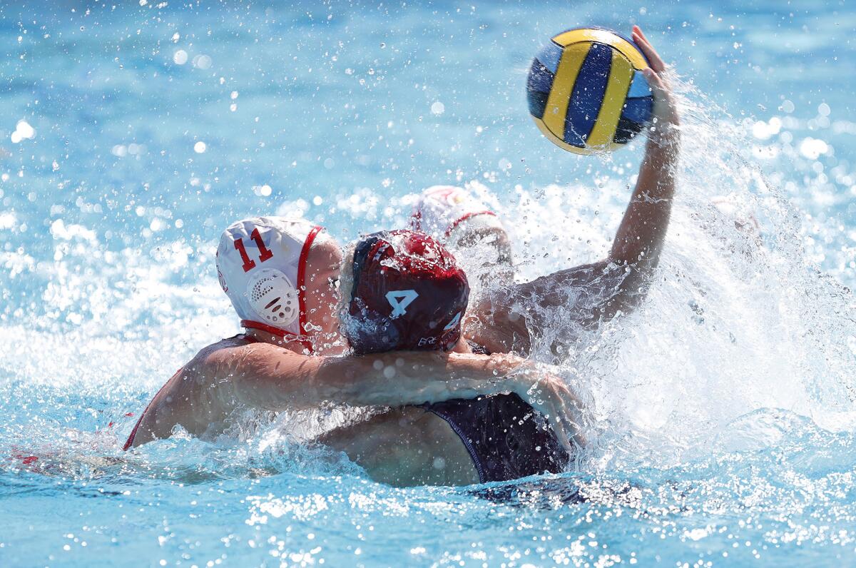 Charlotte Riches (4) of Laguna Beach turns and fires a shot for score against Mater Dei on Friday.