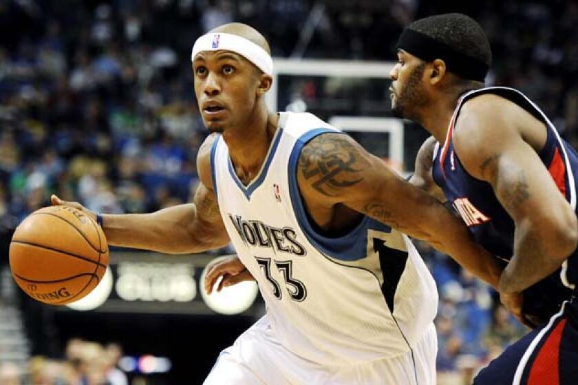 Timberwolves forward Dante Cunningham drives against Atlanta's Josh Smith during a game last week.