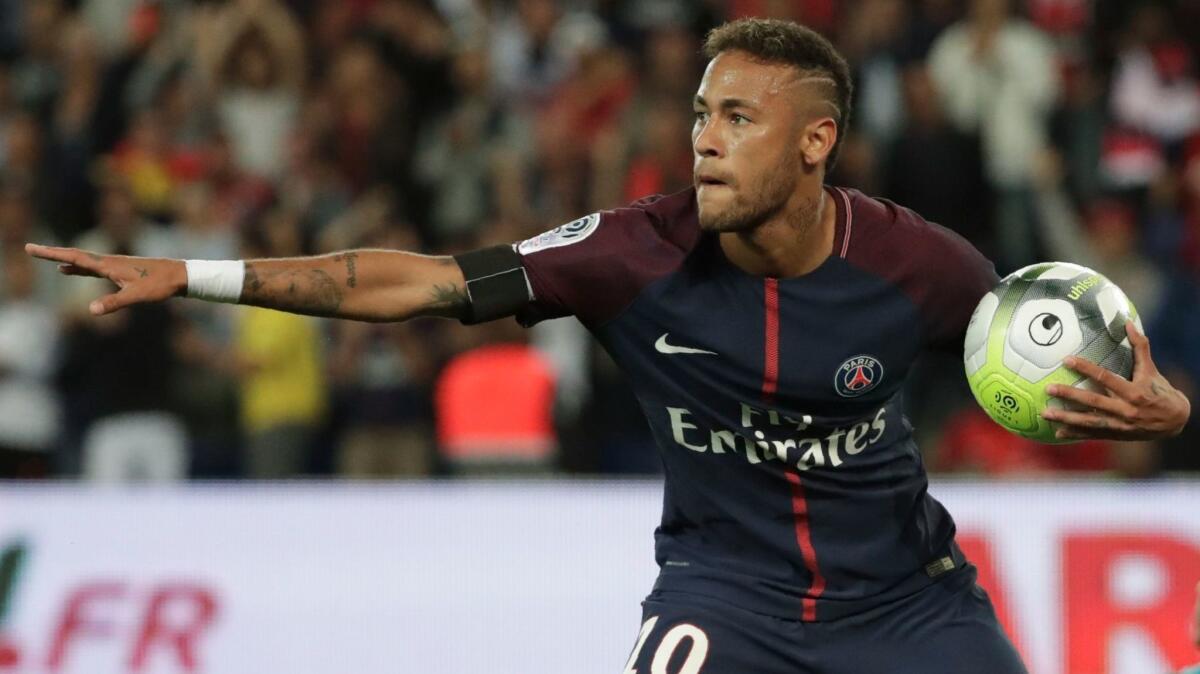 Paris Saint-Germain forward Neymar celebrates after scoring a goal against Toulouse FC on Aug. 20.