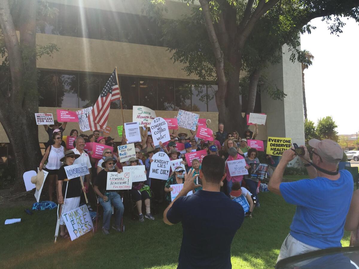 Protesters outside Rep. Steve Knight's office.