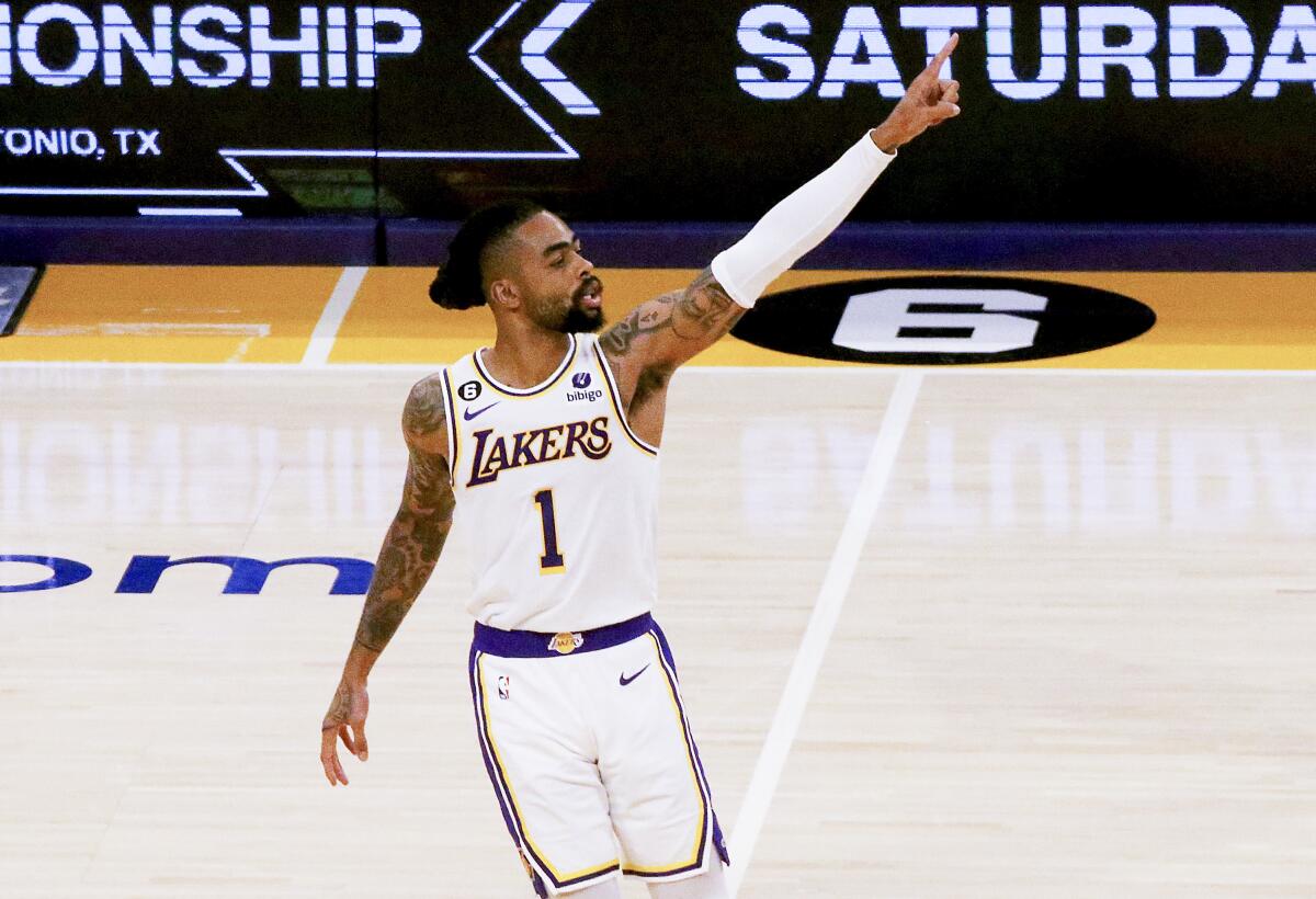 Lakers guard D'Angelo Russell gives the No. 1 sign after making a shot against the Warriors in Game 3.