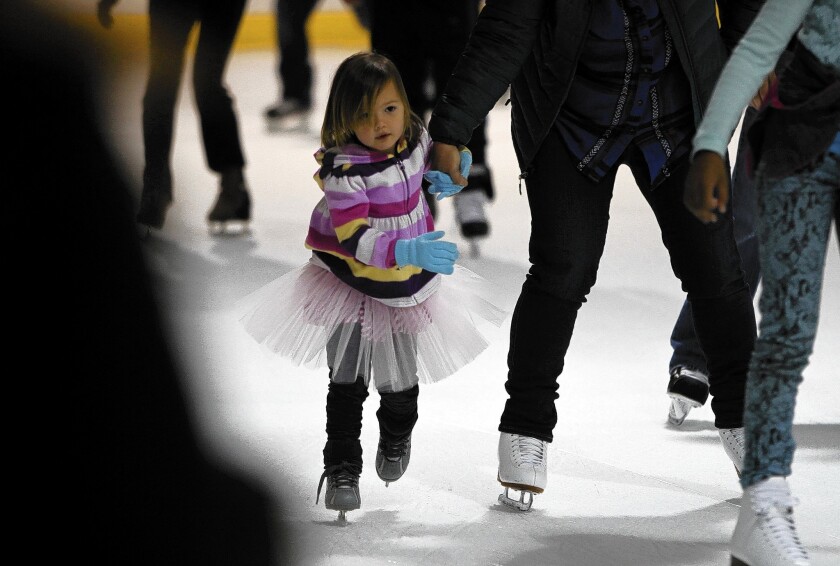 Families circle the rink at the venerable Culver City Ice Arena, which has lost its lease and is scheduled to close next month. For more than half a century, the retro rink has served as a practice facility for U.S. and world skating champions and members of the L.A. Kings hockey team.