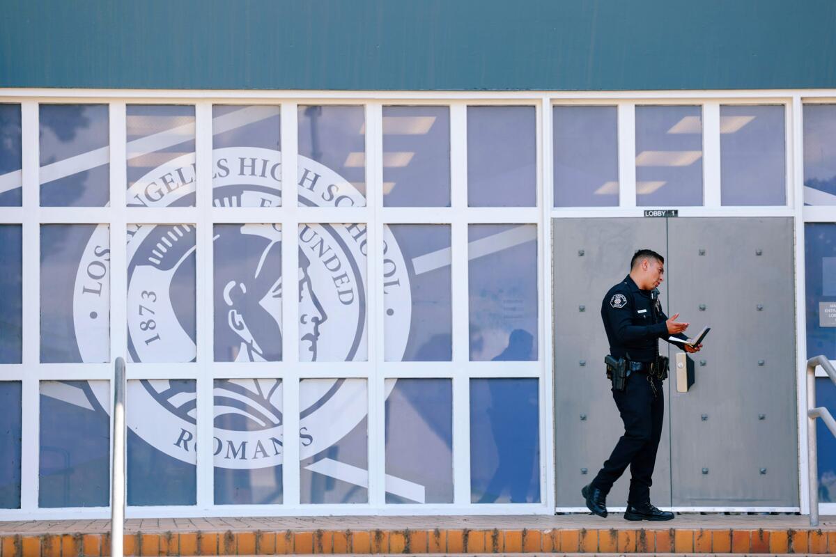 A police officer walks outside of Los Angeles High School 